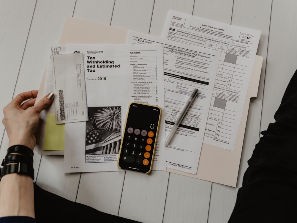 Financial planning documents and a calculator on a desk